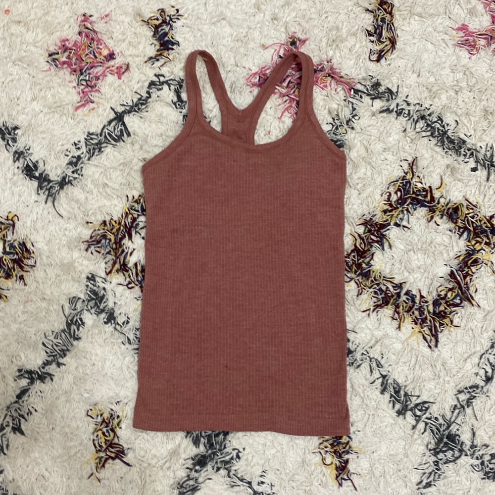 Lululemon ebb to street tank, perfect condition, with pads color is dusty pink